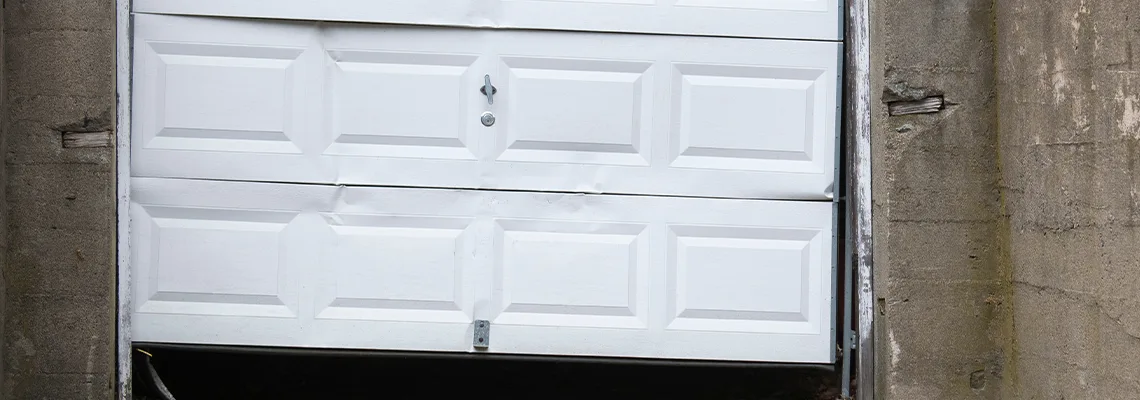 Garage Door Got Hit By A Car Dent Removal in Tamarac, FL